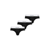 Image 1 : Lot de 3 slips Calvin Klein Underwear homme noirs avec ceinture élastique blanche logotée, vue d'ensemble en diagonal — Delvale