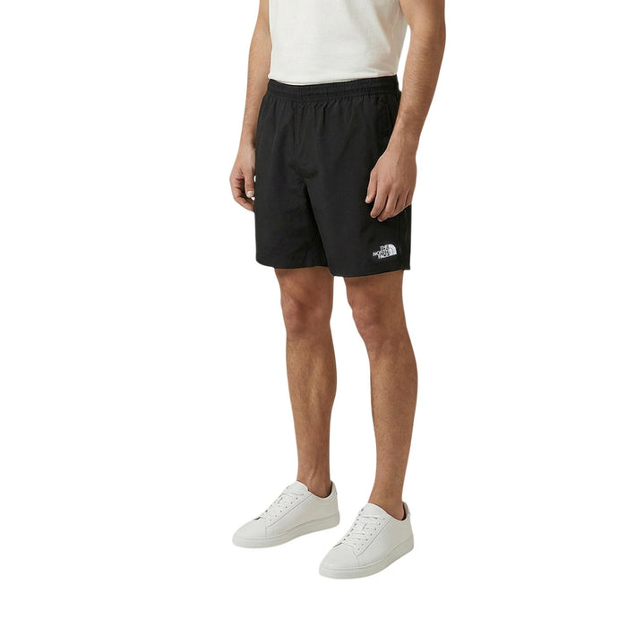 Image 1 : The North Face Short Homme Noir Nylon Technique Poches Frontales Vue de 3/4 — Delvale